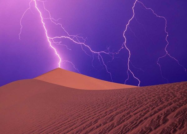 CA, Death Valley NP, Lightning bolts over dunes